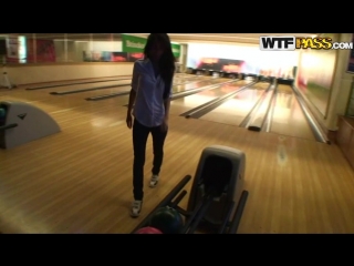 a young couple is having sex in the bathroom of a bowling alley.