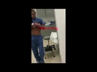 a nurse leads a cam from a hospital room