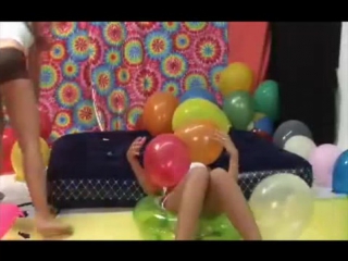 college girls pop balloons